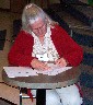 Nancy Smith signs the covenant